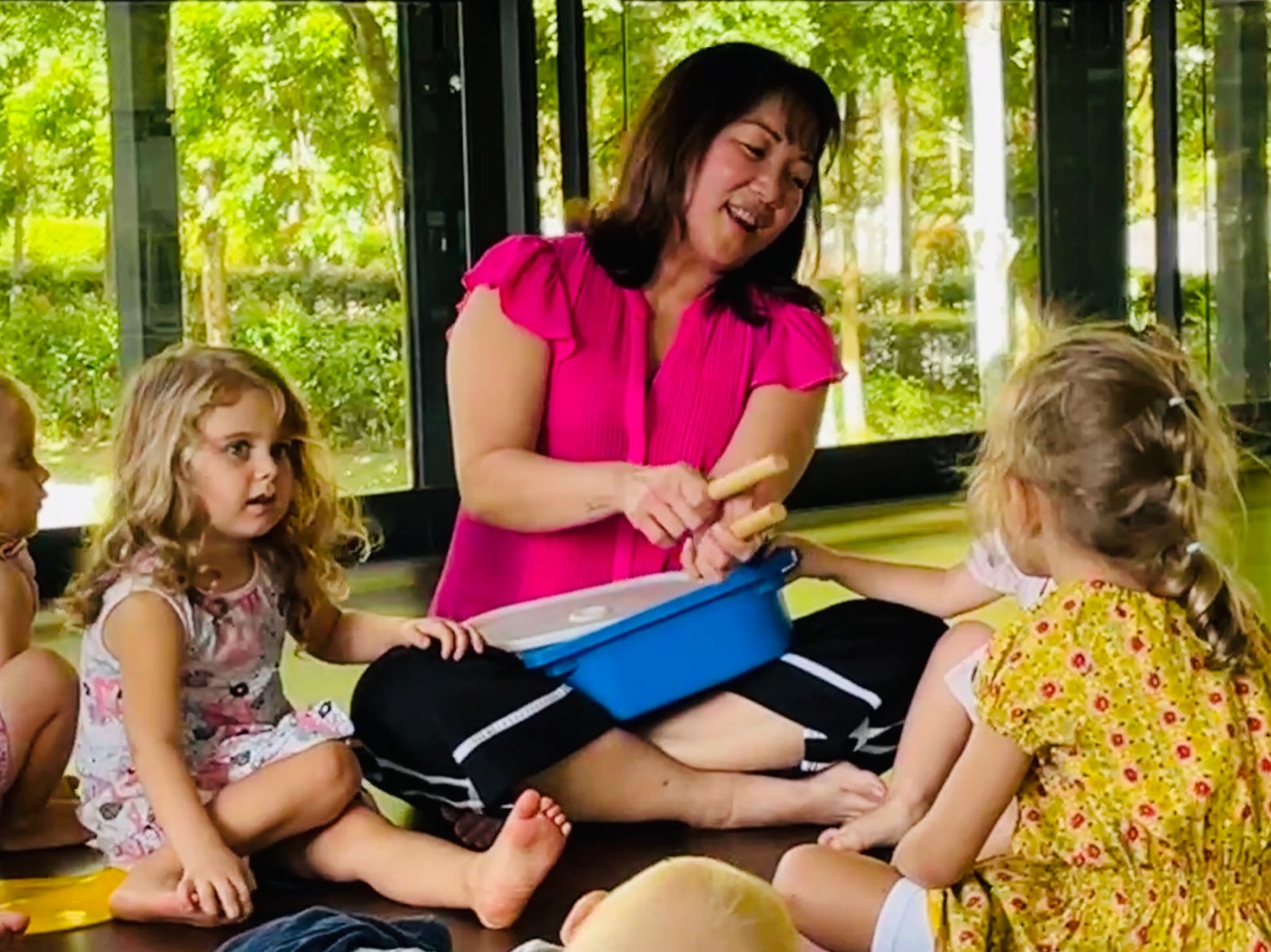 Joyce Goh leading a music class for young children
